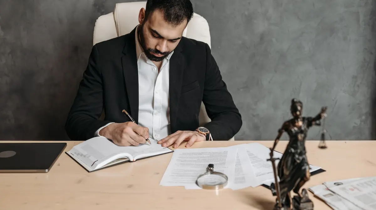an attorney evaluating client documents in preparation to file a claim