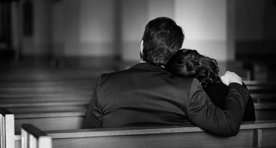 a grieving family in a worship center