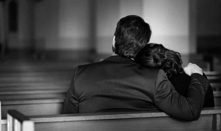 a grieving family in a worship center