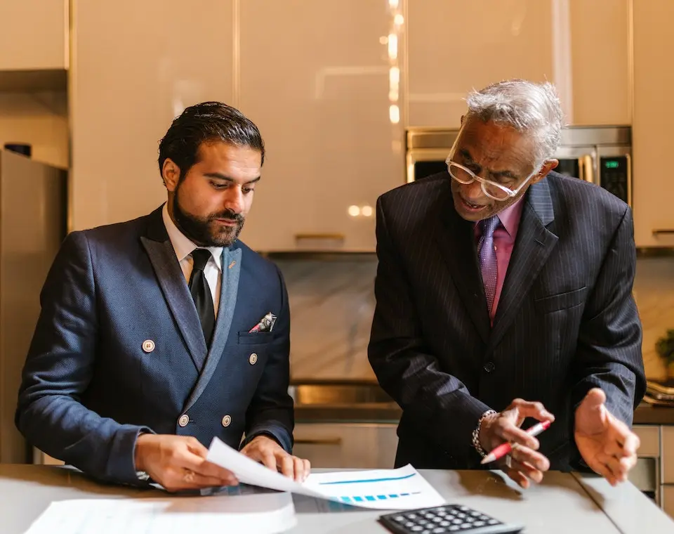 An wrongful death attorney explaining a document to a colleague