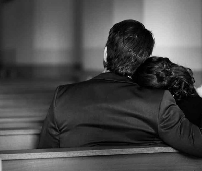 a grieving family in a worship center