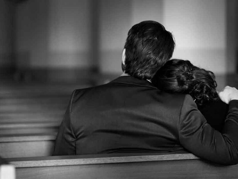 a grieving family in a worship center