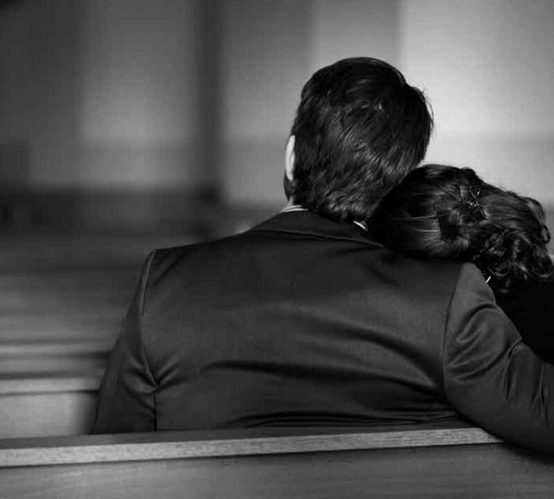 a grieving family in a worship center