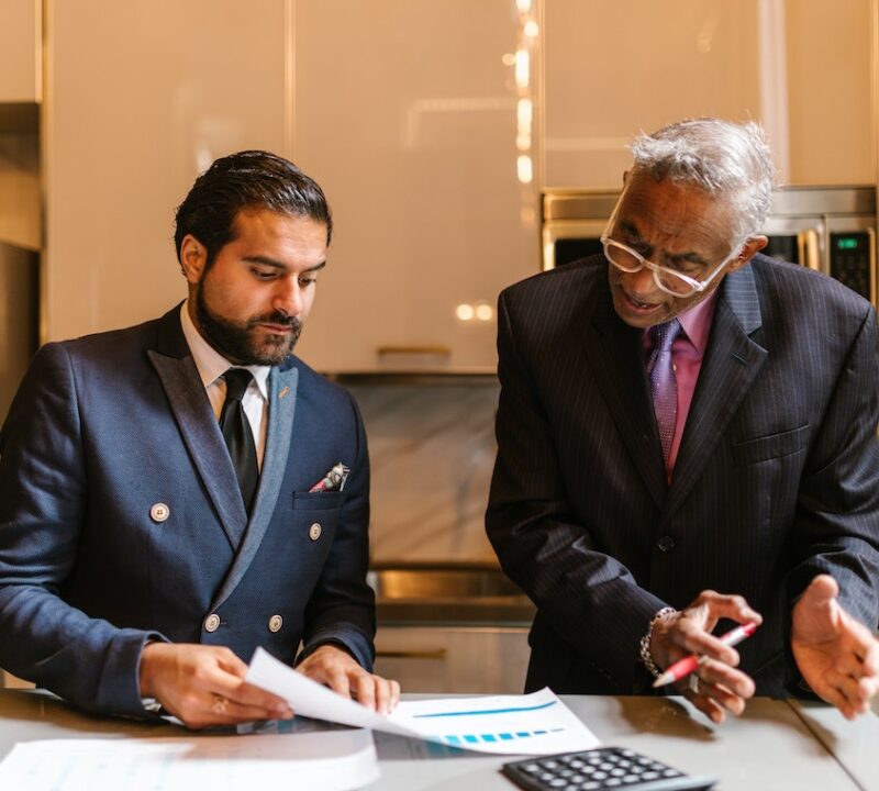An wrongful death attorney explaining a document to a colleague